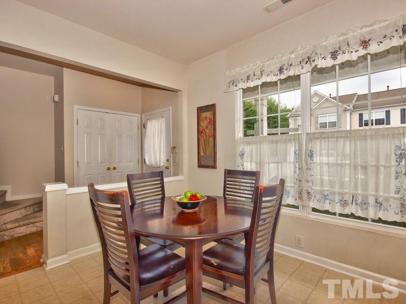 8523 Bright Loop Raleigh, NC 27613 - Photo 3 of 23 a dining room with furniture and window