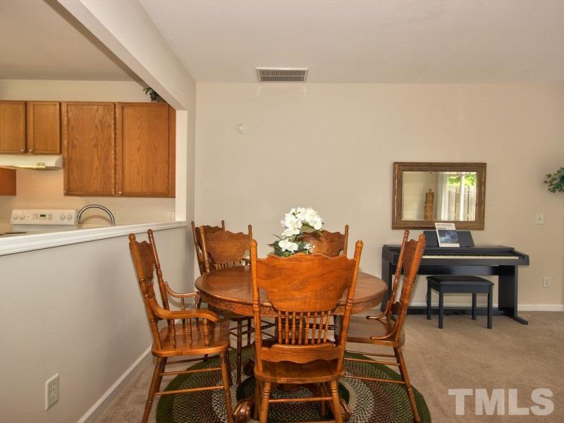 8523 Bright Loop Raleigh, NC 27613 - Photo 6 of 23 a dining room with furniture and window