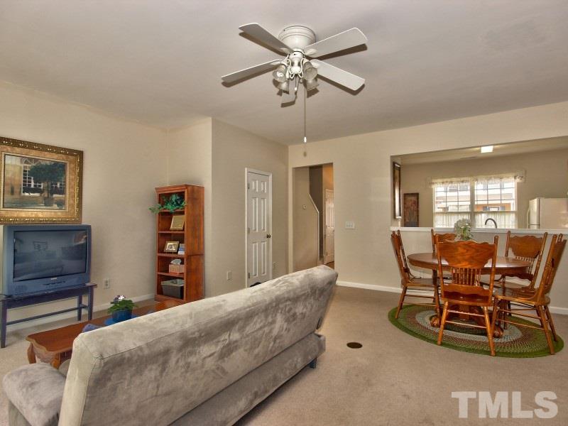 8523 Bright Loop Raleigh, NC 27613 - Photo 10 of 23 a living room with furniture and a wooden floor