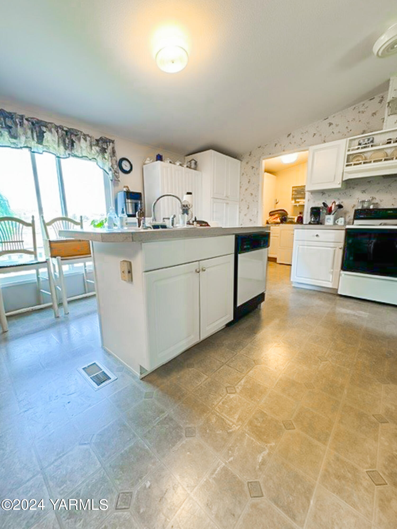16981 Summitview Road Cowiche, WA 98923 - Photo 7 of 22 a large white kitchen with cabinets a sink and appliances