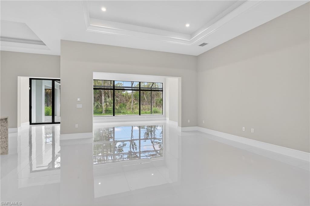 563 15th Street Northwest Naples, FL 34120 - Photo 6 of 22 a view of an empty room with a window