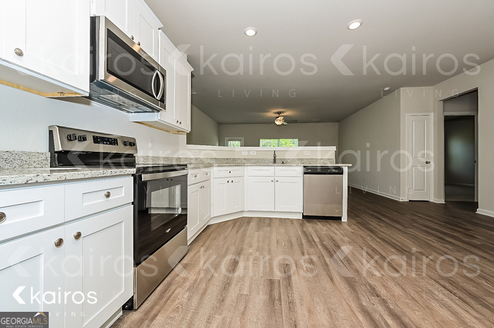 7000 Pinehurst Way North Macon, GA 31216 - Photo 3 of 16 a kitchen with a sink stainless steel appliances and cabinets