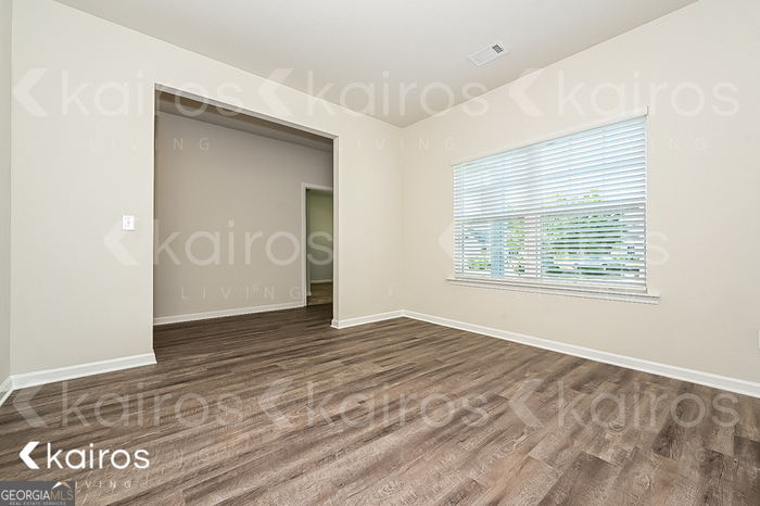7000 Pinehurst Way North Macon, GA 31216 - Photo 4 of 16 a view of an empty room with window and wooden floor