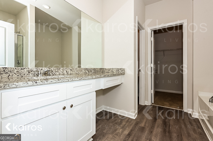 7000 Pinehurst Way North Macon, GA 31216 - Photo 7 of 16 a bathroom with a granite countertop sink and a mirror