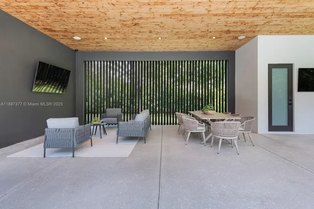 a large kitchen with a table and chairs
