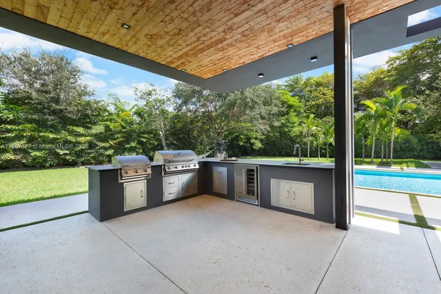 a large kitchen with stainless steel appliances