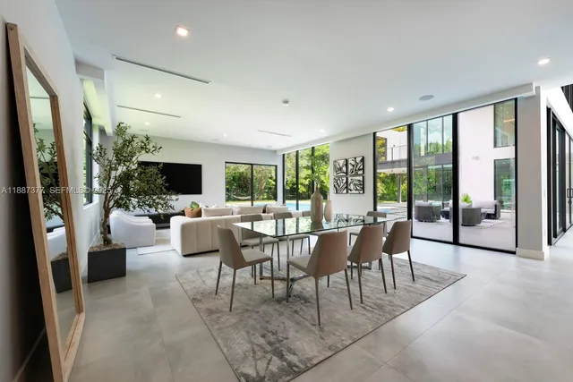 a spacious bedroom with a bed and a large window