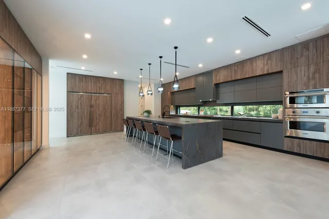 a spacious bedroom with a large bed and a flat screen tv