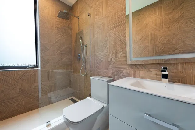 a view of a patio with table and chairs with wooden floor and fence