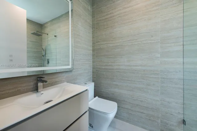 an aerial view of multiple houses with yard