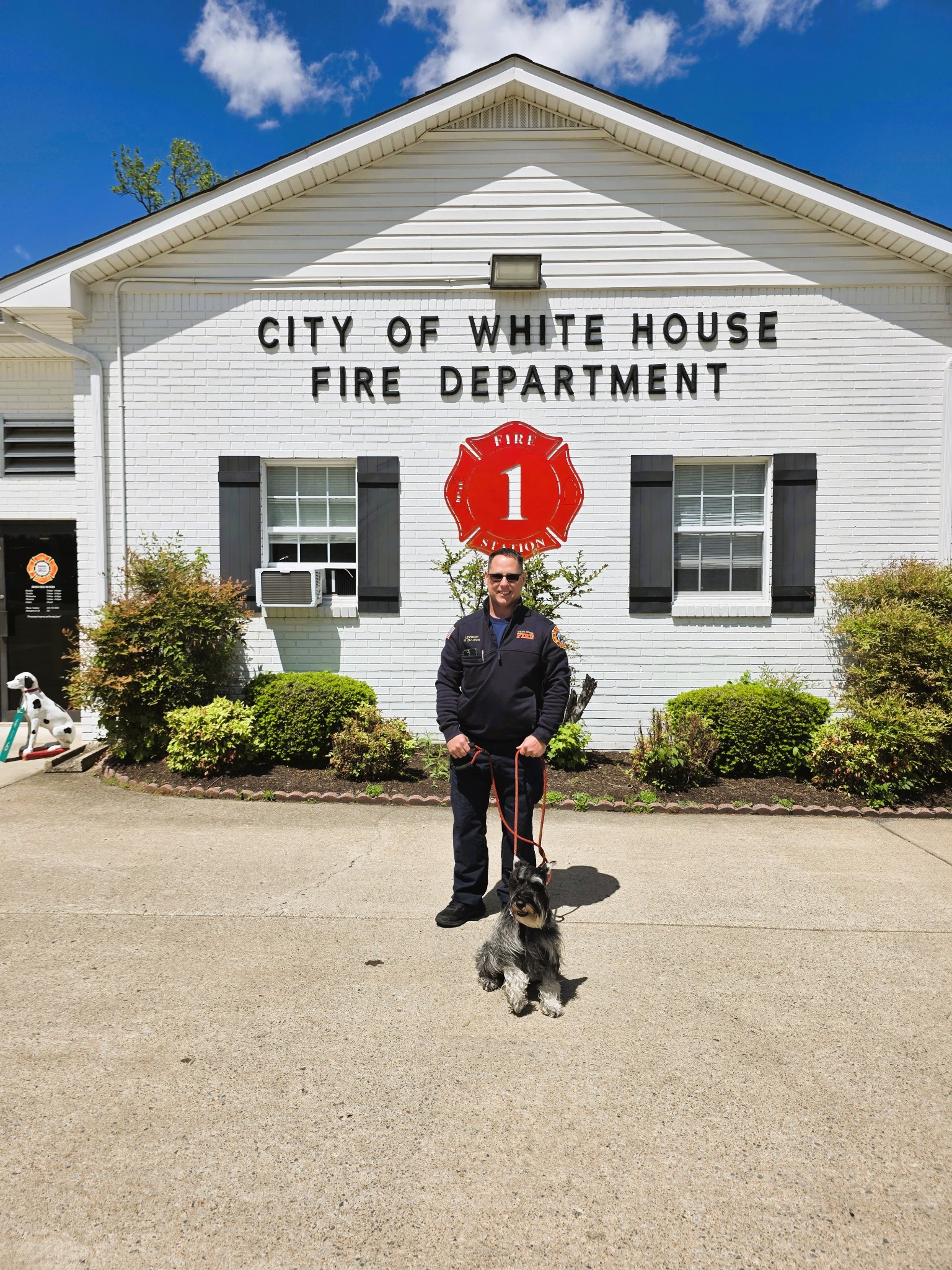 369 Springbrook Boulevard White House, TN 37188 - Photo 29 of 30 a man sitting on a bench in front of a building