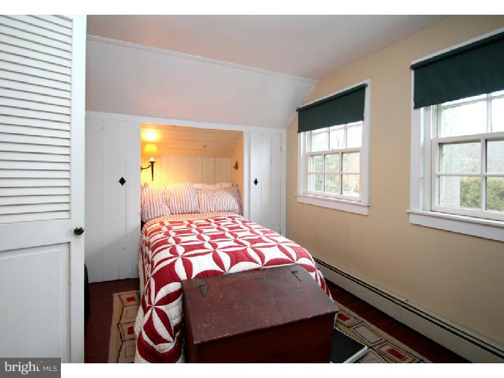 7400 Ferry Road New Hope, PA 18938 - Photo 17 of 20 a bedroom with a bed and two windows