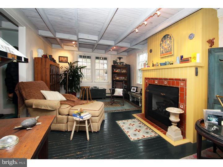 7400 Ferry Road New Hope, PA 18938 - Photo 3 of 20 a living room with furniture a fireplace and a table
