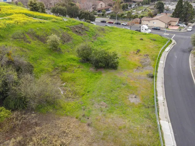 a view of a swimming pool with a yard