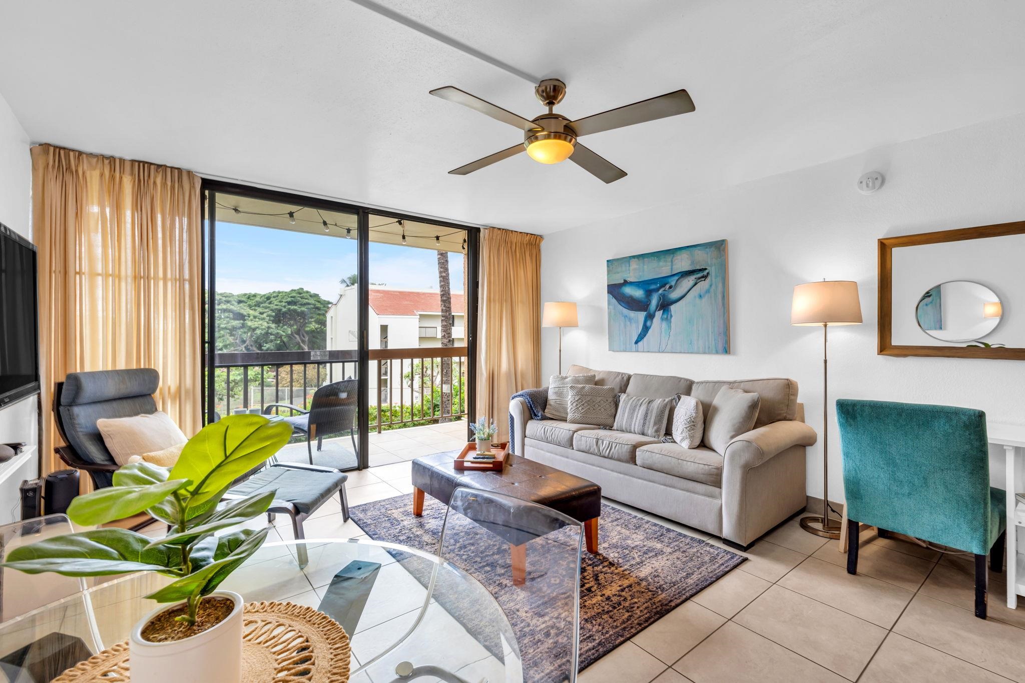 a living room with furniture and a large window