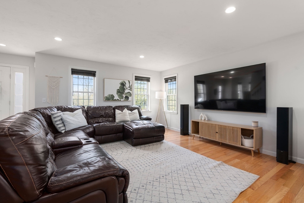 45 Cinnamon Ridge Circle Middleboro, MA 02346 - Photo 8 of 38 a living room with furniture and a flat screen tv