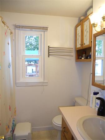 105 Eddy Street Springfield, MA 01104 - Photo 9 of 13 a bathroom with a sink a toilet and a window