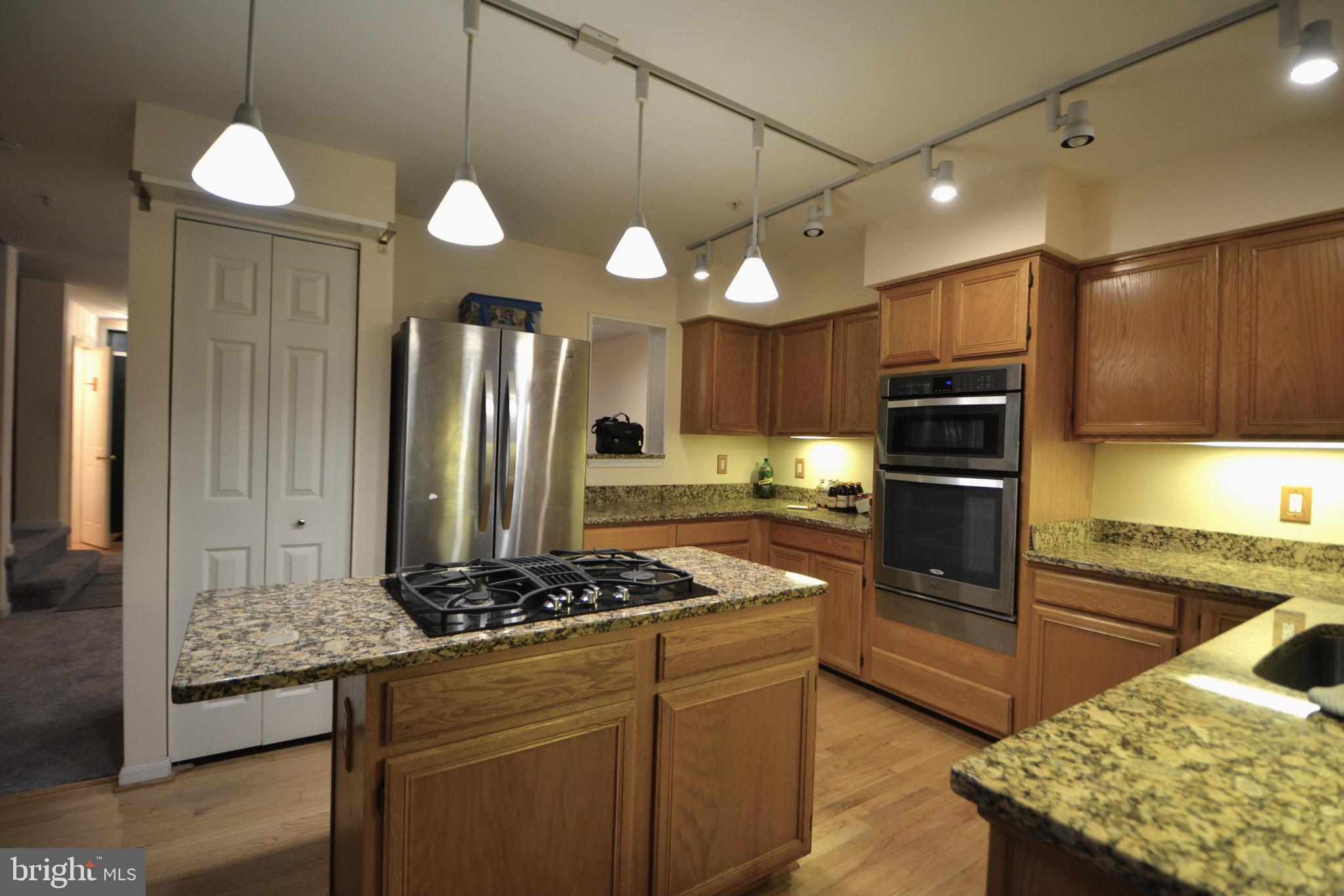 4701 Wainwright Circle Owings Mills, MD 21117 - Photo 12 of 59 Granite countertop, wall oven, built-in microwave.