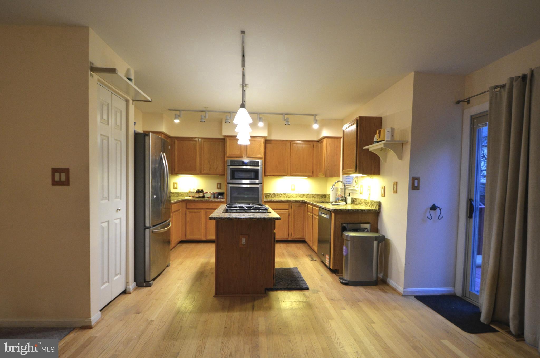 4701 Wainwright Circle Owings Mills, MD 21117 - Photo 13 of 59 Slider to deck, cove lights under cabinets