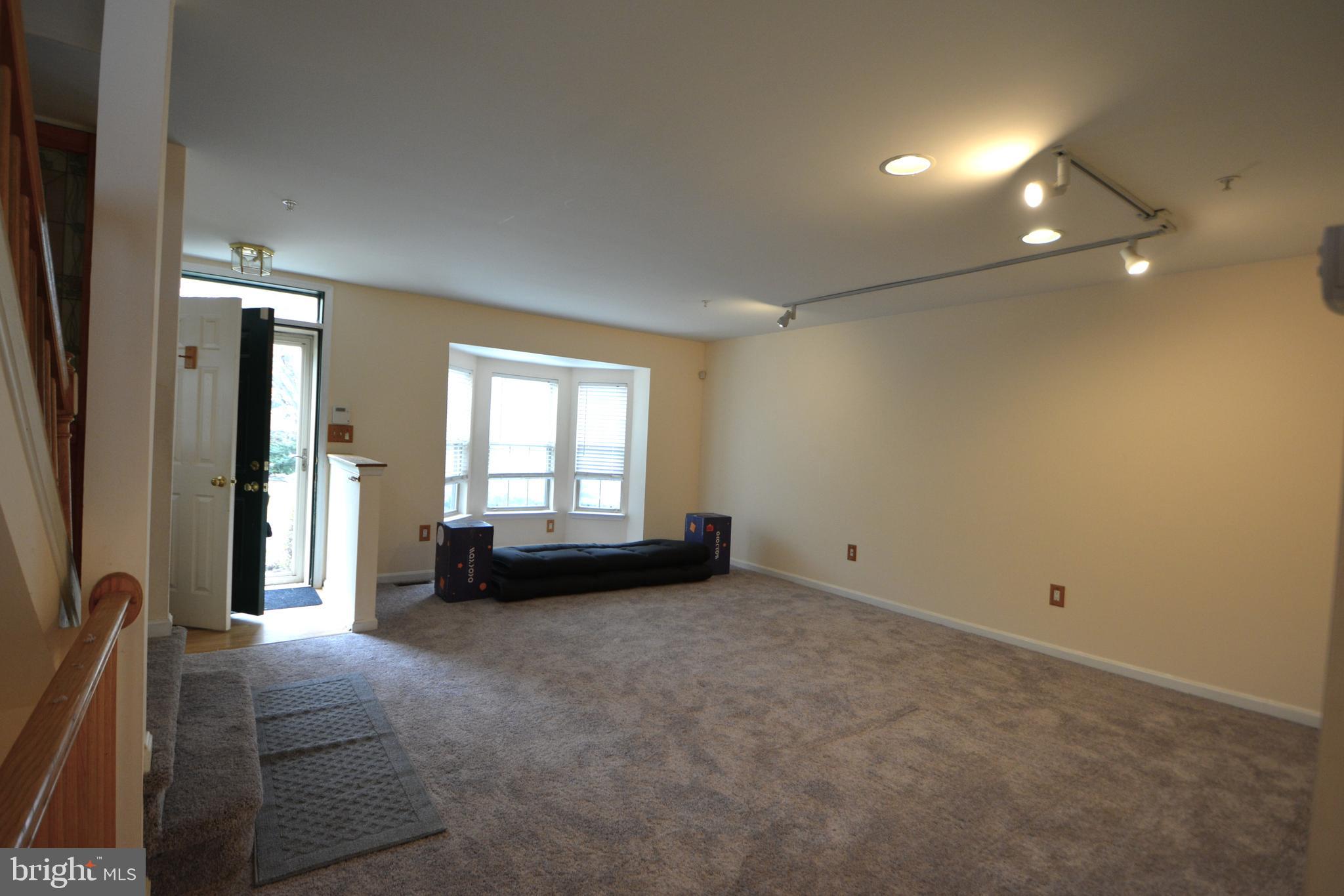 4701 Wainwright Circle Owings Mills, MD 21117 - Photo 7 of 59 Living rm bump out bay window, new gray carpet.