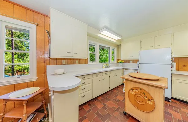 a kitchen that has a stove and a table