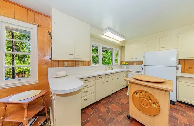 a kitchen that has a stove and a table