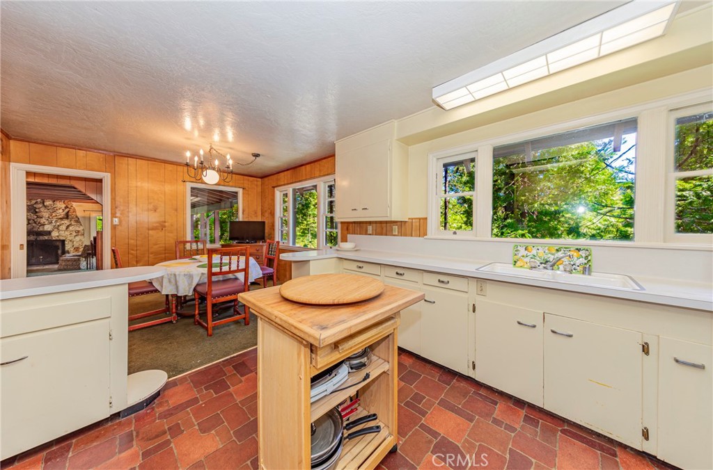 1173 Railroad Avenue Fish Camp, CA 93623 - Photo 14 of 75 a kitchen with a sink stove and cabinets
