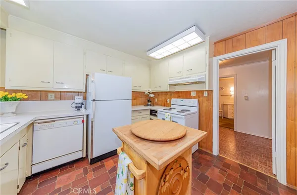 a bedroom with a bed and a dresser in it