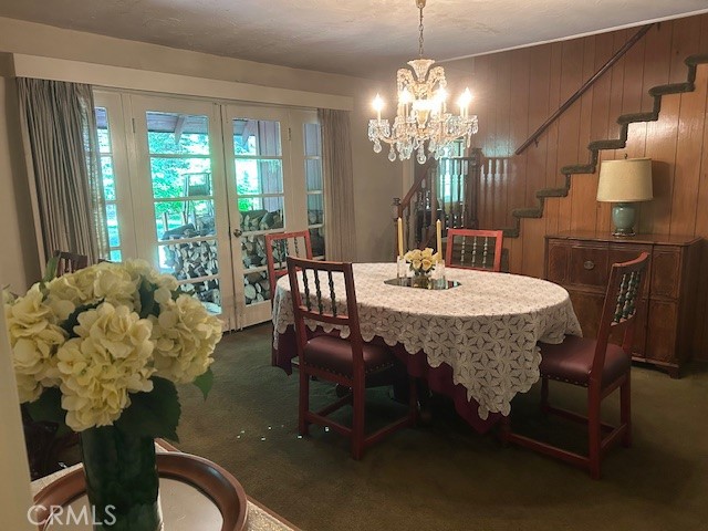 1173 Railroad Avenue Fish Camp, CA 93623 - Photo 17 of 75 a dining room with furniture a chandelier and window
