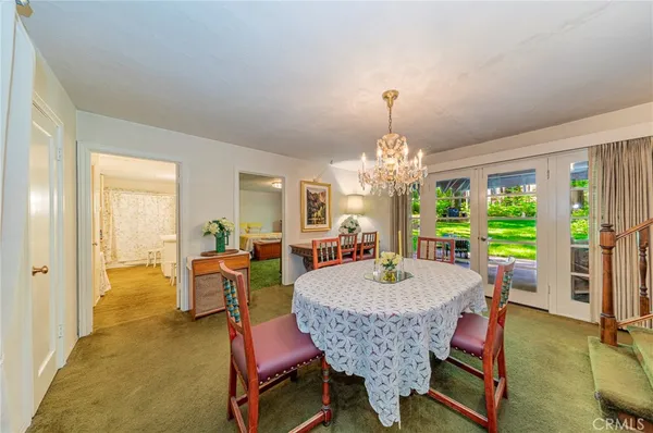a spacious bathroom with a granite countertop sink and a mirror