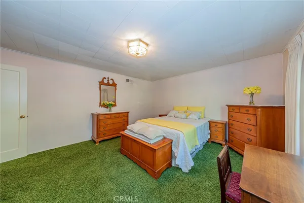 a bedroom with a bed and a table