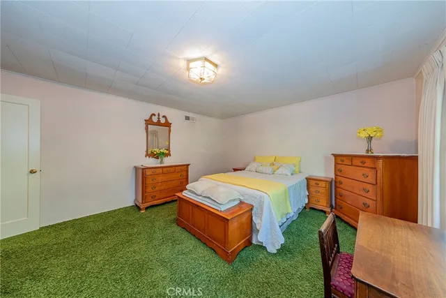 a bedroom with a bed and a table