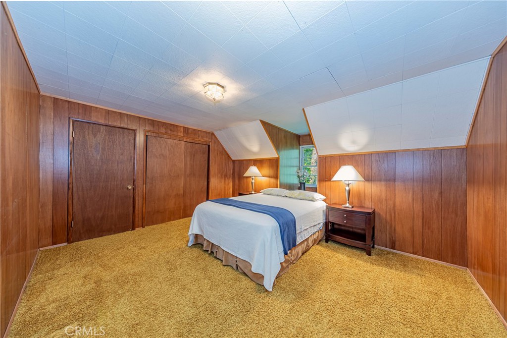 1173 Railroad Avenue Fish Camp, CA 93623 - Photo 31 of 75 a bedroom with a bed and a closet