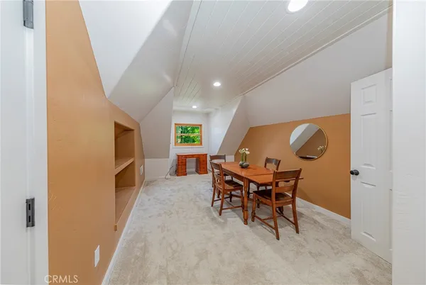 a view of a table and chairs in the garden