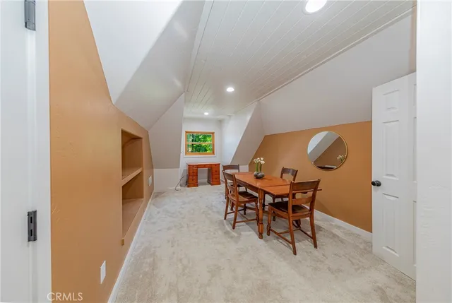 a view of a table and chairs in the garden