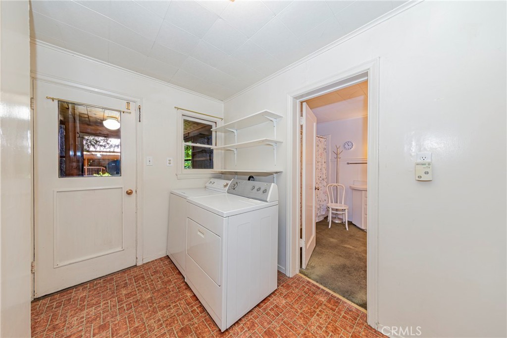 1173 Railroad Avenue Fish Camp, CA 93623 - Photo 42 of 75 a view of hallway with washer and dryer