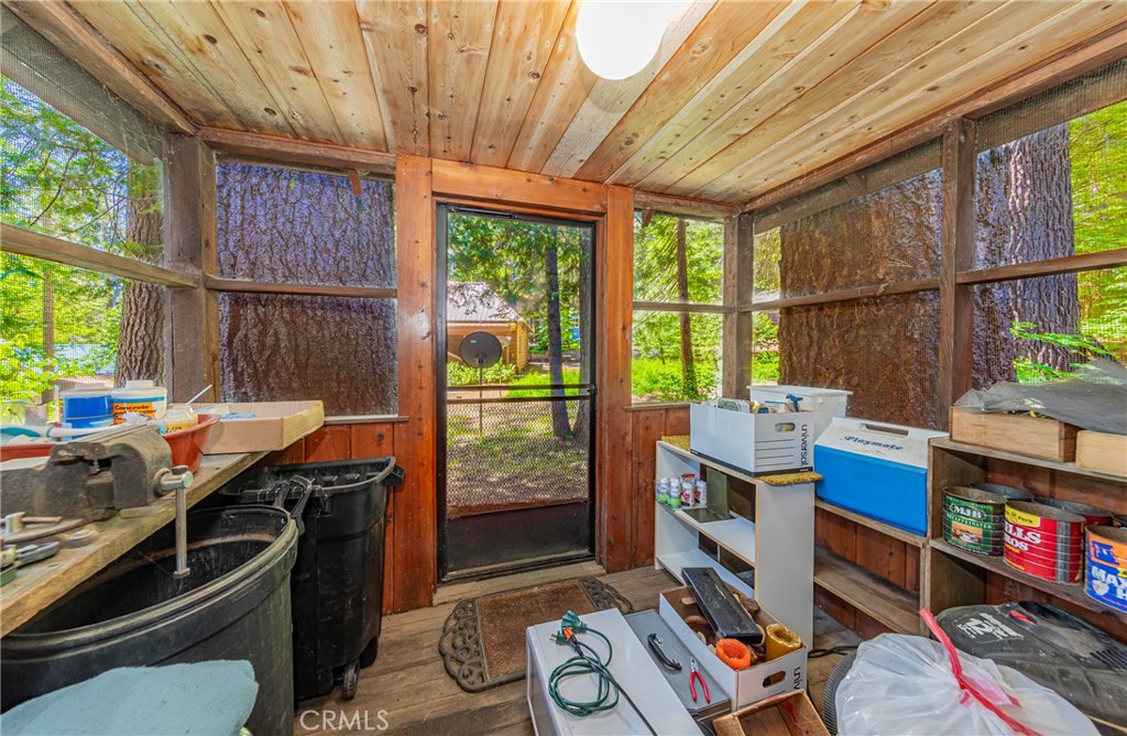 1173 Railroad Avenue Fish Camp, CA 93623 - Photo 44 of 75 a work room with furniture and a floor to ceiling window