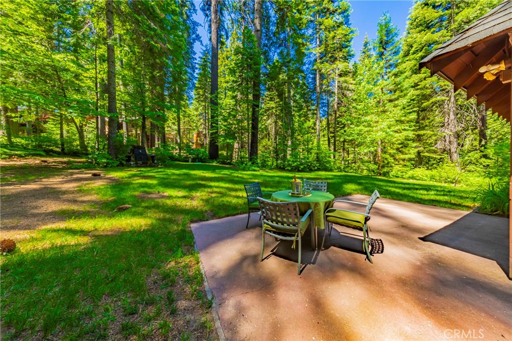 1173 Railroad Avenue Fish Camp, CA 93623 - Photo 53 of 75 a view of a backyard with table and chairs and plants