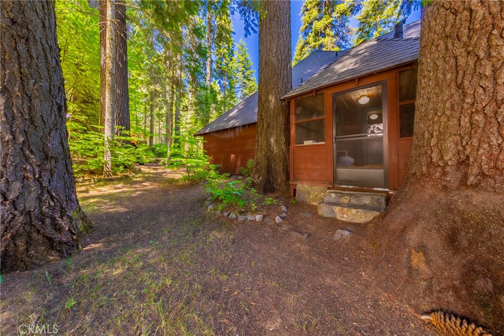 1173 Railroad Avenue Fish Camp, CA 93623 - Photo 58 of 75 a view of a house with backyard and garden