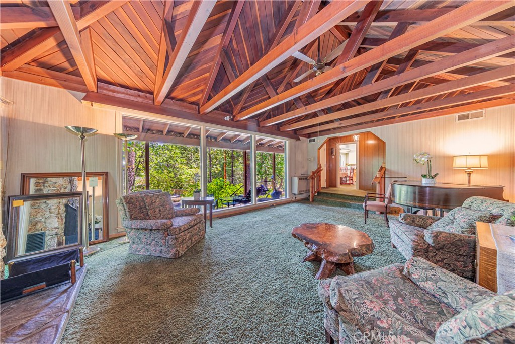 1173 Railroad Avenue Fish Camp, CA 93623 - Photo 6 of 75 a room with furniture and a floor to ceiling window