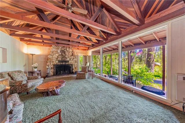 a view of a dining room with furniture a chandelier and wooden floor
