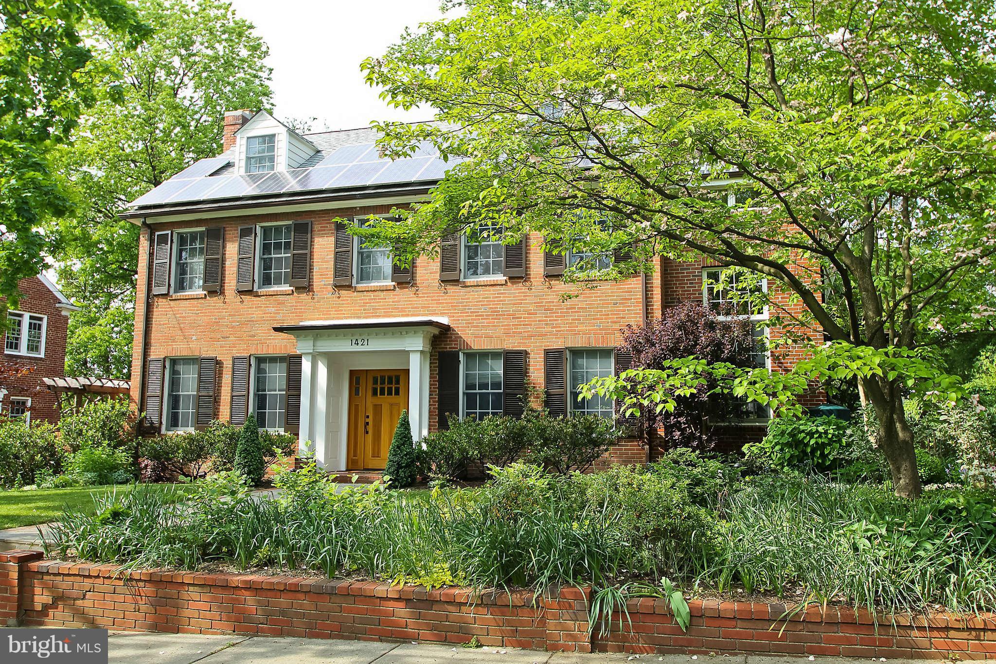 1421 Locust Road Northwest Washington, DC 20012 - Photo 1 of 30 a front view of a house with a yard