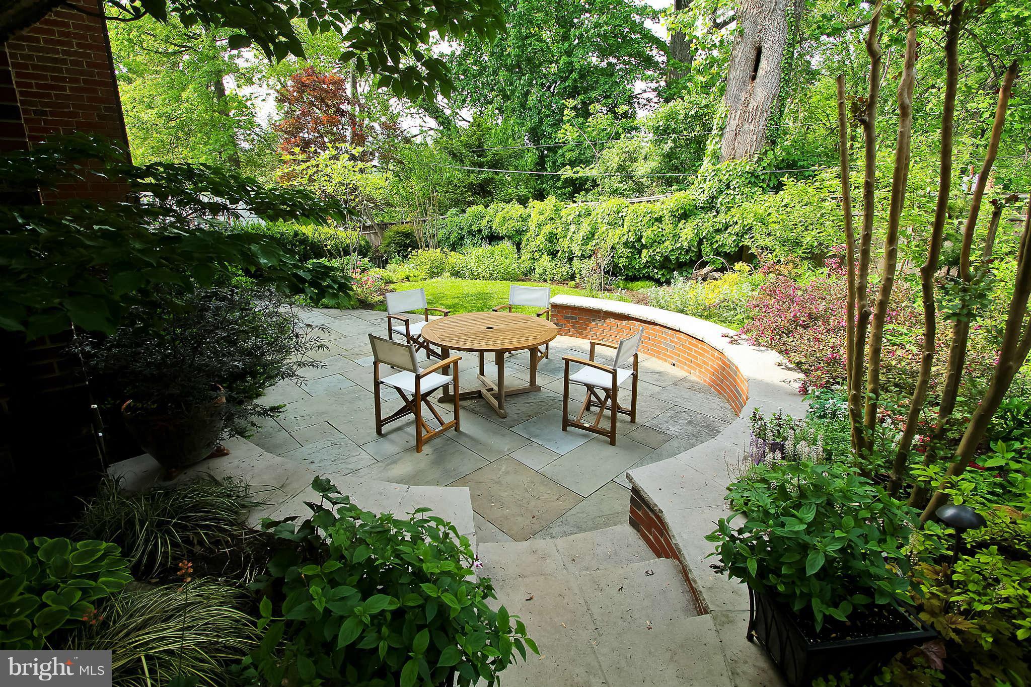 1421 Locust Road Northwest Washington, DC 20012 - Photo 2 of 30 a view of a patio with table and chairs and potted plants