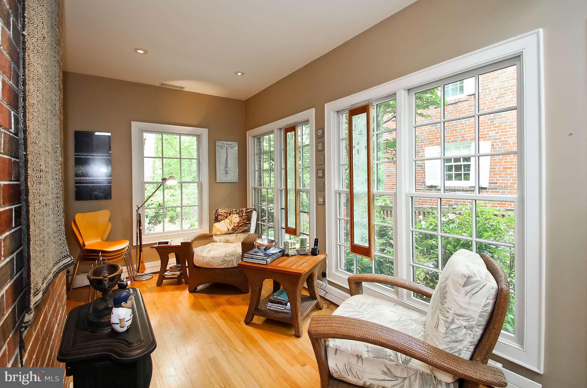 1421 Locust Road Northwest Washington, DC 20012 - Photo 16 of 30 a living room with furniture and floor to ceiling windows