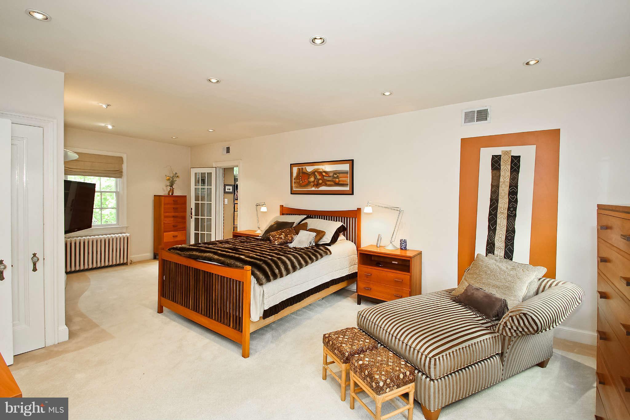 1421 Locust Road Northwest Washington, DC 20012 - Photo 20 of 30 a bedroom with furniture and a couch