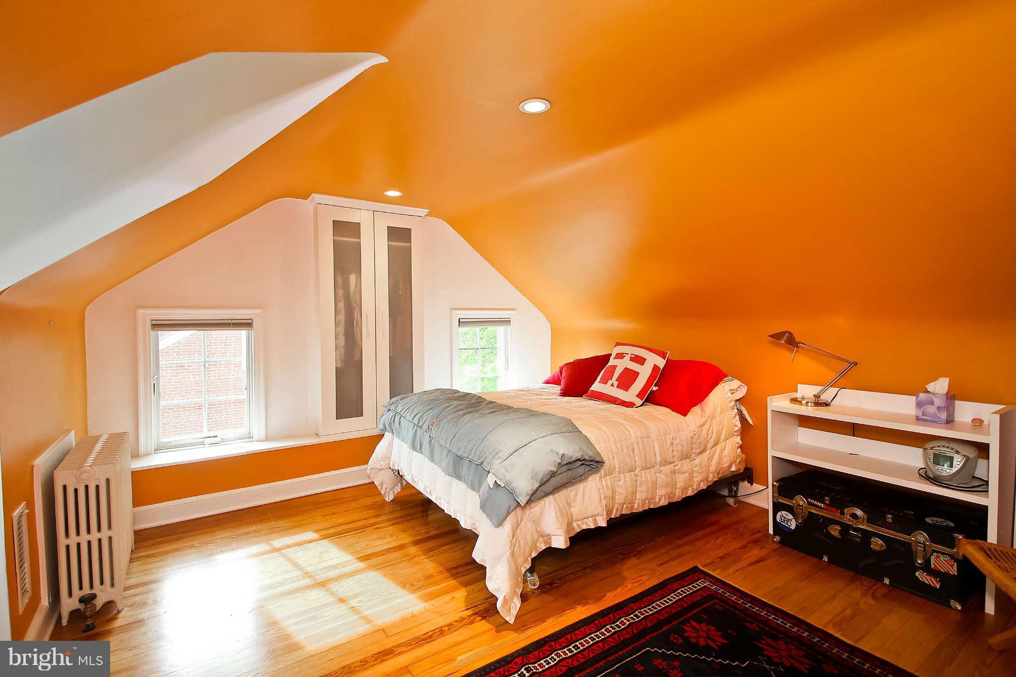 1421 Locust Road Northwest Washington, DC 20012 - Photo 25 of 30 a bedroom with a bed and a window