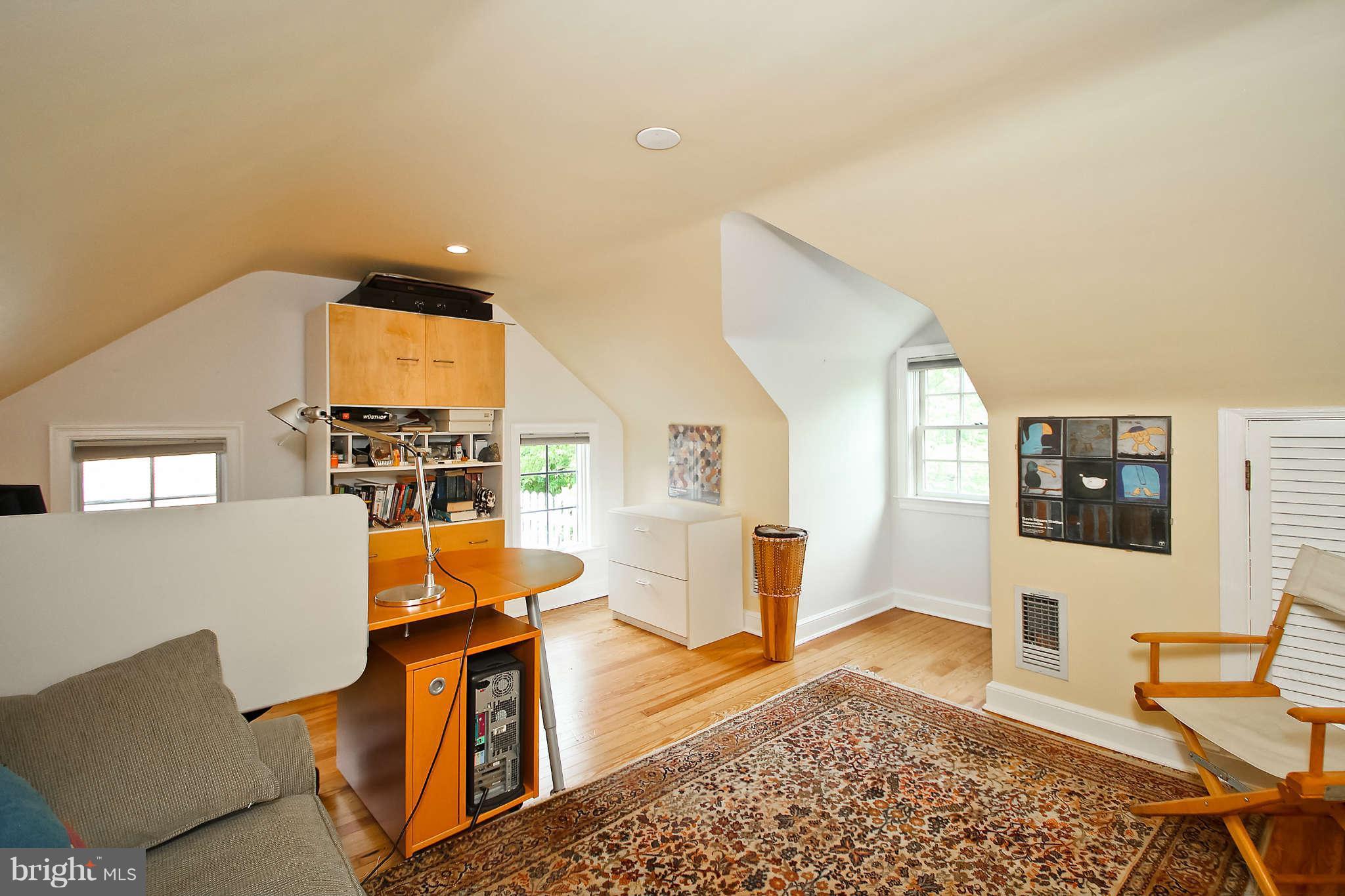 1421 Locust Road Northwest Washington, DC 20012 - Photo 26 of 30 a living room with furniture a rug and a window