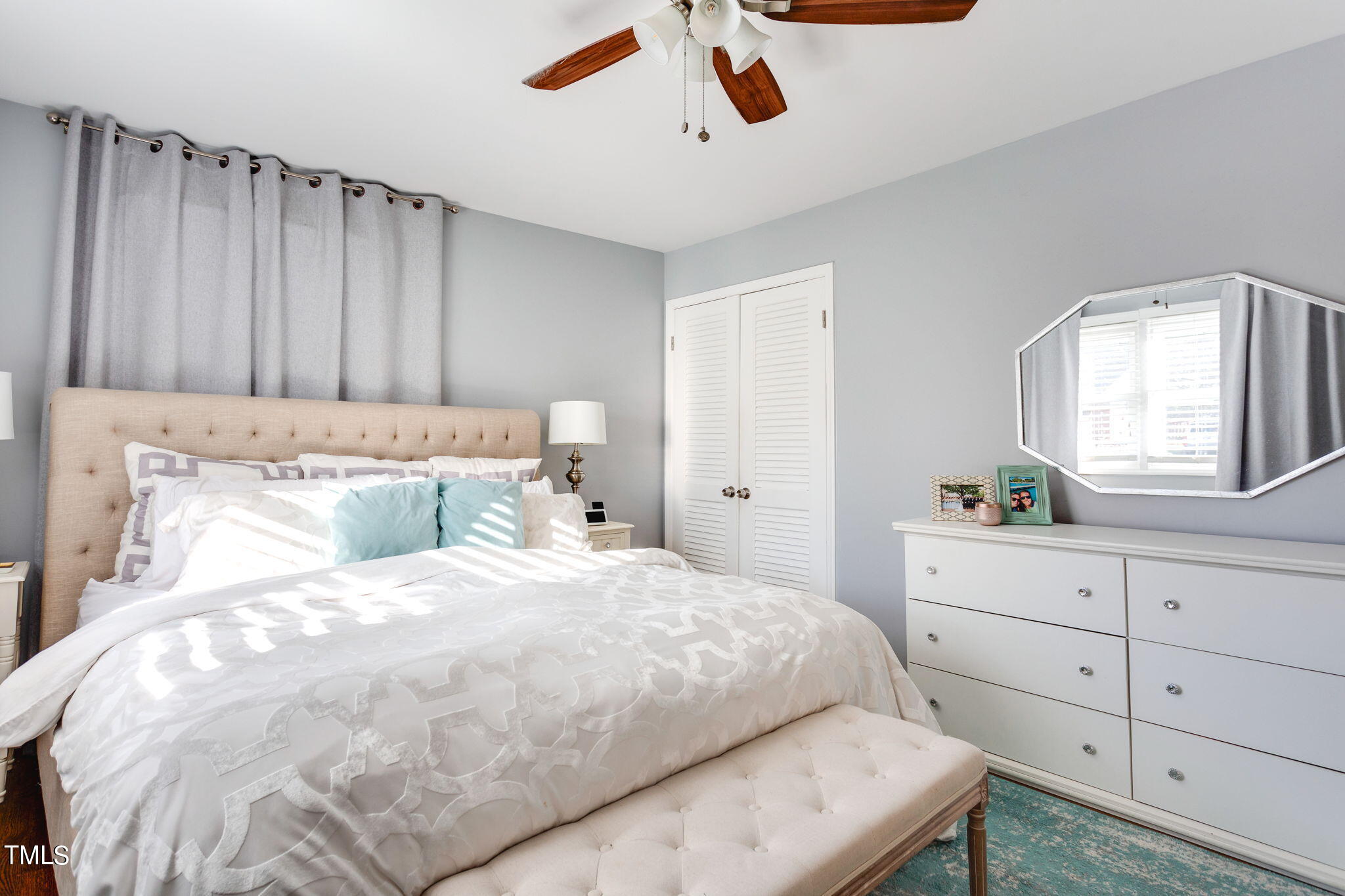 4904 Latimer Road Raleigh, NC 27609 - Photo 18 of 33 a bedroom with a bed and a dresser