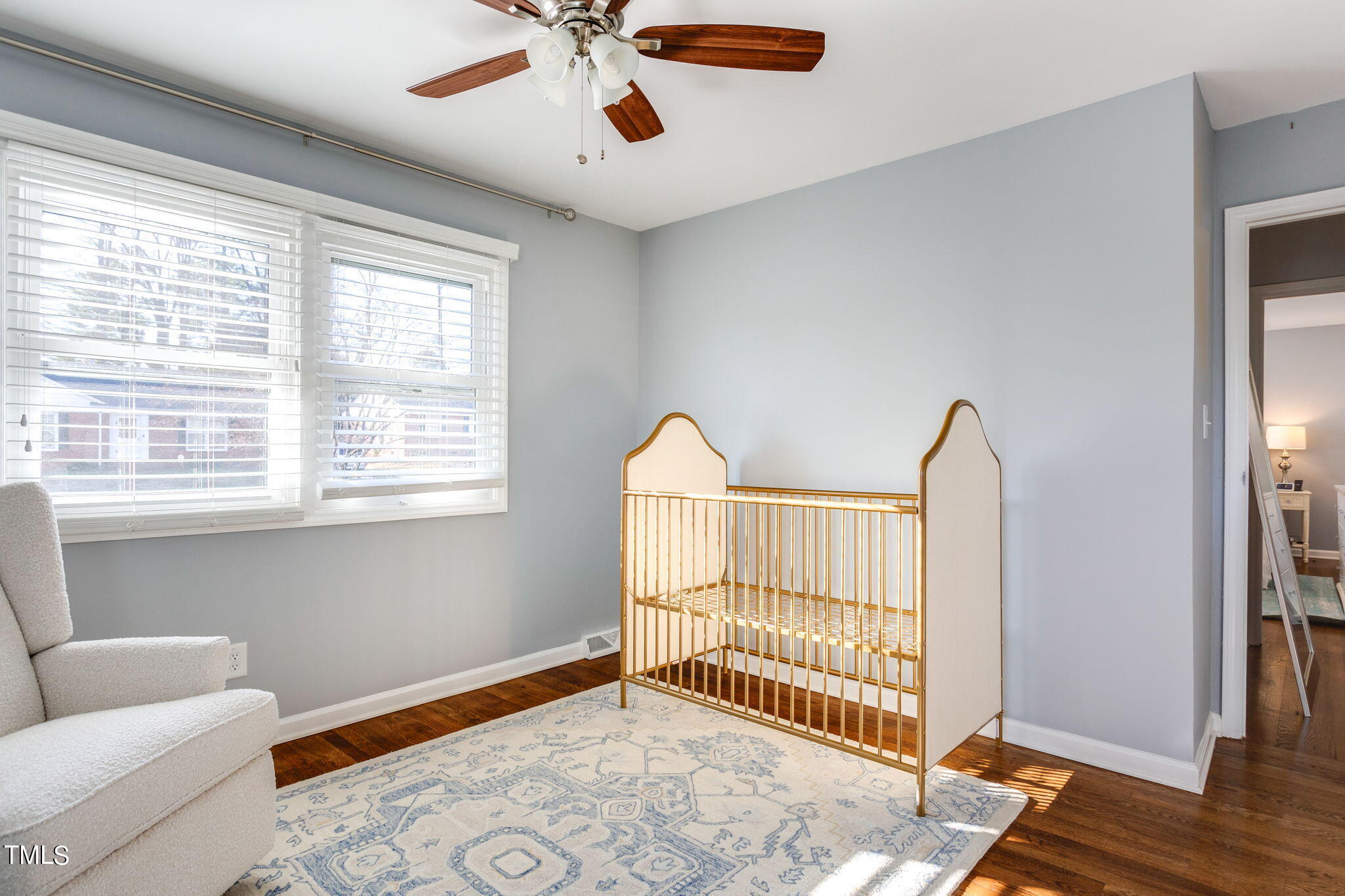 4904 Latimer Road Raleigh, NC 27609 - Photo 23 of 33 a view of an empty room with a window and wooden floor
