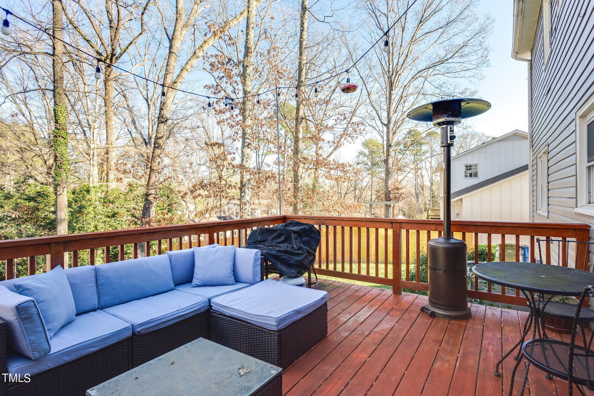 4904 Latimer Road Raleigh, NC 27609 - Photo 26 of 33 a balcony with wooden floor and outdoor seating